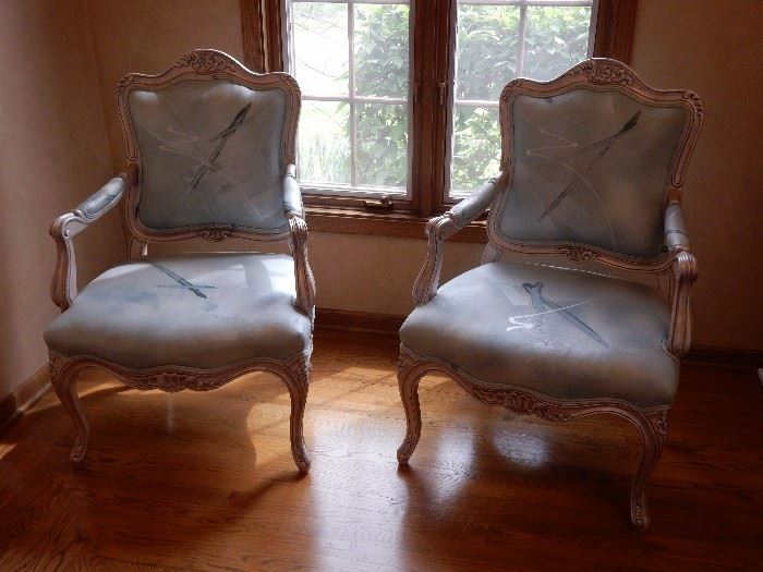pair of specialty chairs, each one is hand painted and the fabric is hand painted as well