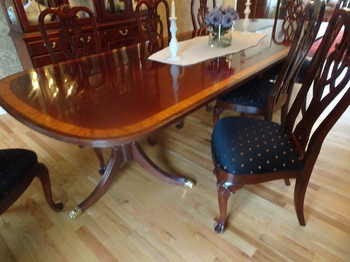 Ethan Allen Mahogany Double Pedestal Dining Room Table with glided feet & Inlaid banding on surface. 8 Chairs & 2 leaves. Table Measures 72"L X 46"W X 30"H. Also 2 leaves - 24 "each total length 120".  