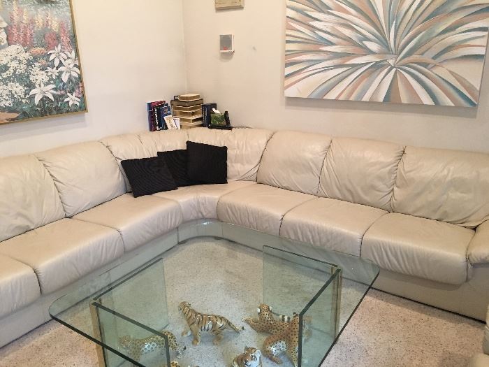 White leather sectional sofa & glass coffee table 