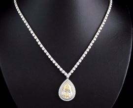 Appraised Retail Value: $240,000.   Asking: $130,000
Platinum/18K gold -  8.94 ct  pear shape yellow diamond pendant set with 0.95 cts tw of white diamonds on an 18K gold/white rhodium diamond necklace set with 112 round diamonds approx. 12 cts tw .  THIS ITEM IS IN A BANK VAULT FOR INSURANCE REASONS.  IT WILL NOT BE ON-SITE.       Call 800-289-2850 for a private  appointment to view these items.
