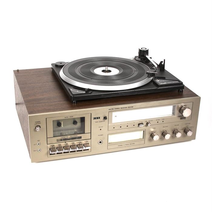 Vintage Montgomery Ward AM/FM Stereo Receiver and Turntable: A vintage Montgomery Ward model GEN6340A AM/FM receiver with 8-track recorder, cassette recorder and semi-automatic model 6340 turntable. A user’s manual is included.