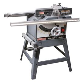Craftsman 10-Inch Table Saw System: A Craftsman 10-Inch Table Saw System. This electric table saw is made by “Sears, Roebuck, and Co. Model 315.228110, Serial Number T009411131”. The saw powers on but is otherwise untested. It is located in the garage of the seller’s home.