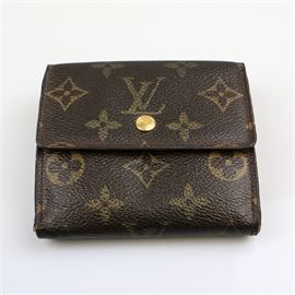 Vintage Louis Vuitton Monogram Wallet: A vintage Louis Vuitton wallet in classic dark brown monogrammed coated canvas with a textured leather lining, a change purse to one side, a card slot to the other with button snap closures. The interior is marked “Louis Vuitton Paris Made in U.S.A.”