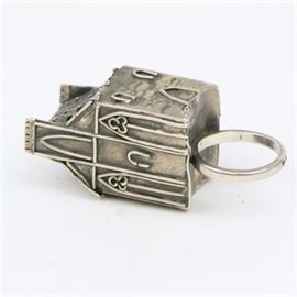 Sterling Silver Jewish Wedding Ring: A vintage sterling silver Jewish wedding ring. This handcrafted ring depicts an architectural form, which symbolizes the couples marital home. It is embellished with applied symbols and designs and is soldered to a simple shank. The piece is marked “925” with a second illegible mark and has a total approximate weight of 0.82 ozt.