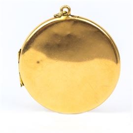 Antique Alfred E. Jones 15K Yellow Gold Locket: An antique English 15K yellow gold locket by Alfred E. Jones, circa 1912. It is round in shape and features a hinge on one side with a round loop at the top.