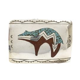 Native American Style Sterling Silver, Coral, and Turquoise Bear Belt Buckle: A Native American style sterling silver belt buckle. It features a curved rectangular shape with rounded corners and an inlaid coral and turquoise bear to the center with Southwestern designs around the edges. The verso is marked “Sterling HB” and it has a total approximate weight of 0.95 ozt.