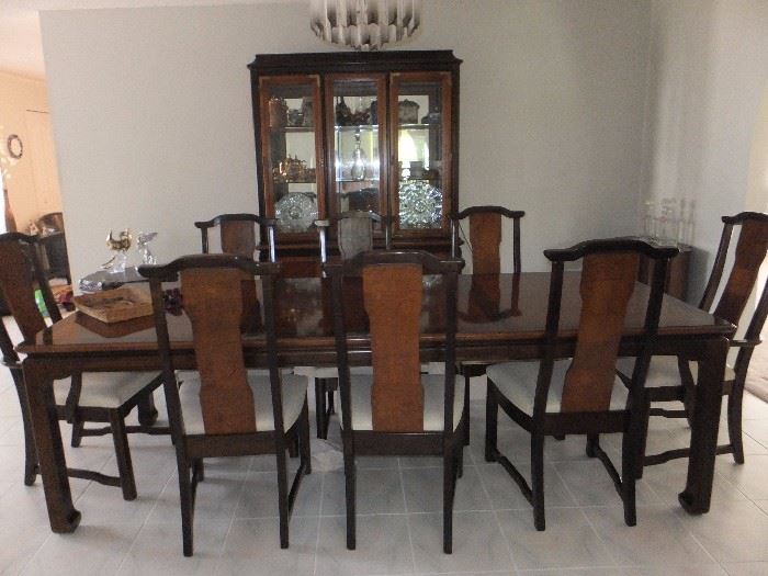 Broyhill Premier Dining table and china cabinet.  Polynesian walnut and burled wood with brass accents.  Table shown with 2 leafs and 8 chairs