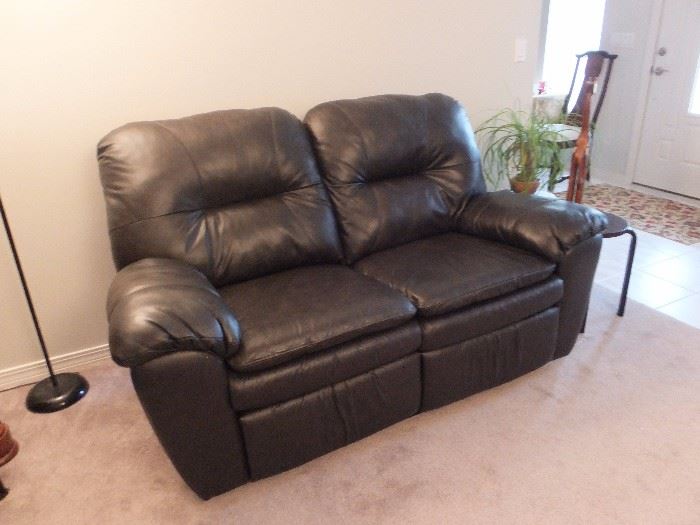 Dark brown leather match dual recliner love seat