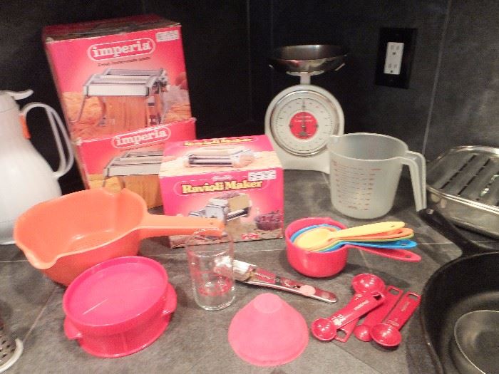 2 pasta makers in boxes and a ravioli maker in box