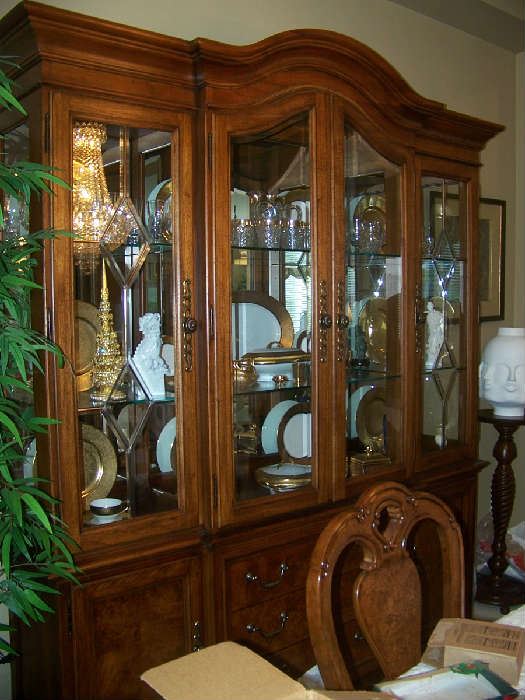 If you are looking for a dining room set-this is the one! 4 panel glass china cabinet-the glass is beveled and the cabinet is lighted