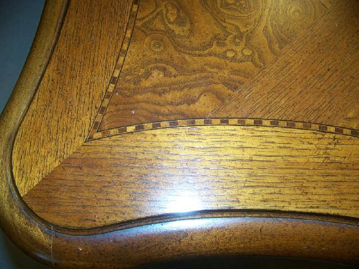 Top of table , inlaid -always covered, no scratches 