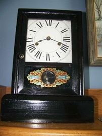 Antique clock-needs refinishing-pendulum there