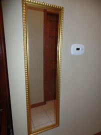 Tall gold wall mirror
