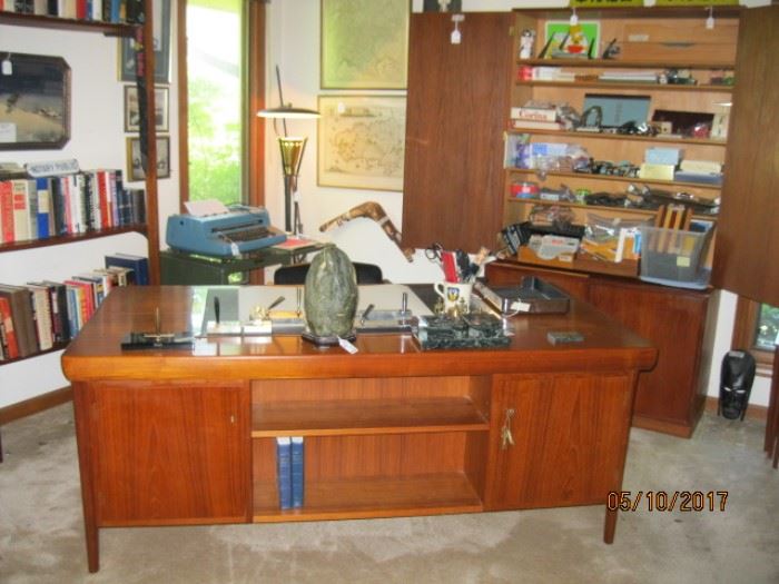 Teak desk  design by K. B. Simonsen, six drawers with slide above each column of drawers. Front view here, two locking cabinets and an adjustable bookcase shelf.