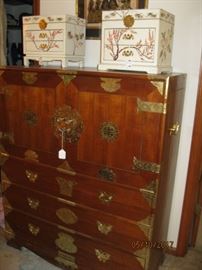 Asian Chest with brass hardware. Double blind doors open to interior compartments and drawers.
