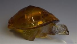 
Crafted of fine quality amber to clear colored French art glass. Depicting a turtle or tortoise as a symbol of luck and longevity. Signed/ etched on bottom. Measures 6" x 4". Excellent condition with no surface scratches. In house USA continental shipping $45 plus insurance.