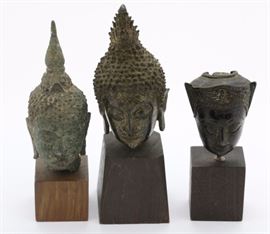 
Group of three South East Asian bronze Buddha head statue fragments. Circa 12-14th century. All mounted on wood stands. Good condition with patina and wear commensurate with age. Largest measures 3 1/2" x 1 3/4" without stand. In house USA continental shipping $55 plus insurance