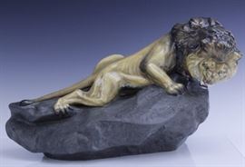 
Figurine crafted of fine quality English bone china porcelain. Number HN2641. Large scale sculpture features a Lion on a rock. Hand painted in realistic natural tones. Designed by Charles Noke first issued in 1952 and retired in 1981. Signed with the green Royal Doulton backstamp. Measures 10" x 10" x 17" Very good condition with no chips, cracks, breaks or repairs. Will not ship. Will refer a local shipper