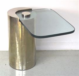 Karl Springer occasional table, c. 1970. Modern style with chrome finish and cantilevered glass top. Tube style base Measures 18" x 25". Very good condition with mild surface wear. Will not ship. Will refer a local shipper.