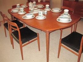 Teak Mid Century Table with 6 matching Dining Chairs.