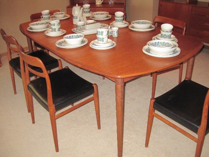 Teak Mid Century Table with 6 matching Dining Chairs.