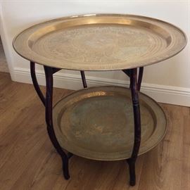 Ornate Round Brass Tray Table from Hong Kong. Top Tray is 30" diameter. Bottom Tray is 26" Tray. 24 1/2" Height. 
