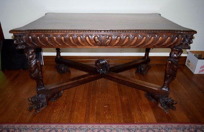Fab carved gothic table, dog heads  northwind faces, soldiers