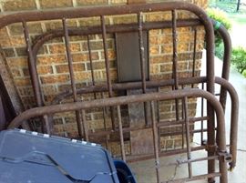 Two vintage iron bed headboards & footboards - in carport