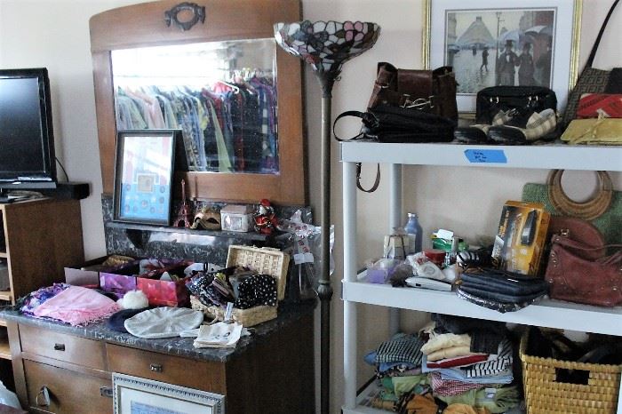 stained glass lamp, dressing table with mirror and granite top, small flat screen tv, purses, scarves, etc