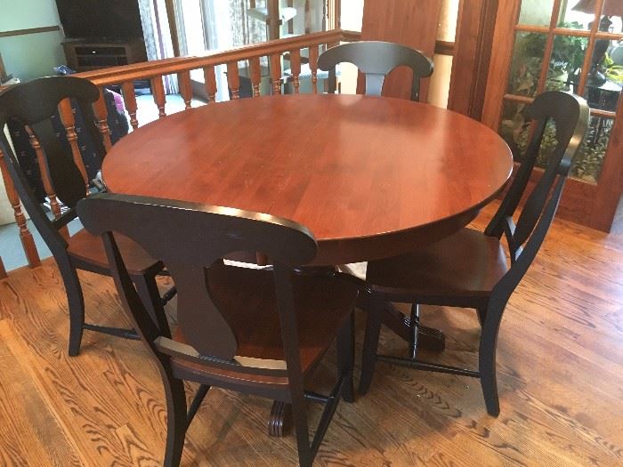 Gorgeous round Canadel kitchen table with leaf extension, 4 chairs with black trim.  Pre-sale $600