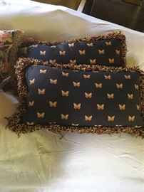 Navy/gold butterfly pattern throw pillows with fringe