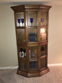 Lighted curio cabinet with multiple shelves