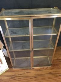 Gold finished wall curio cabinet
