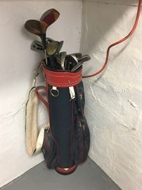 Golf clubs and cart