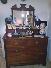 Colonial Style Antique tongue and groove drawer construction with key to lock bottom two drawers...great hardware... nice vanity Perfume and Beaded bag items on top... Little Fenton fan vase on the left and a great brass embellished old dresser mirror under bottles...there is also a pair of nice art nouveau Czech ceramic vases on top with a Whitting Davis Mesh evening bag with rhinestone clasp.