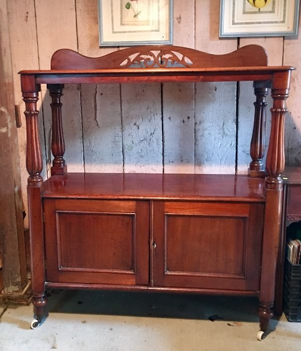 $250. Antique Mahogany buffet on porcelain wheels from England. Wear & condition is consistent with age. Comes with original key. Dimensions 42.0ʺW × 17.0ʺD × 47.0ʺH. 
