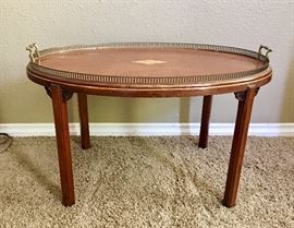 $250. Antique English tray table with center inlaid diamond, pierced brass gallery edge, and cast brass handles. Circa 19th century. Dimensions 33.0ʺW × 21.5ʺD × 19.0ʺH.