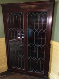 Corner cabinet with leaded windows