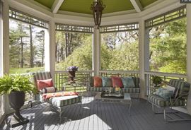 Screened in veranda houses heavy iron outdoor furniture