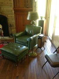 Green Leather Chair and Foot Stool.  Notice magazine rack with tray top and drawer.