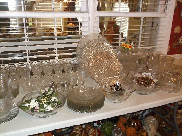 Pressed glass plates, platters, bowls, and goblets