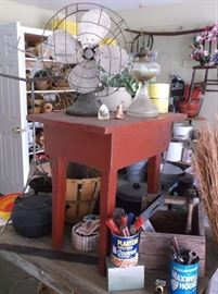 Red primitive table and Hunter fan, cast iron kettle