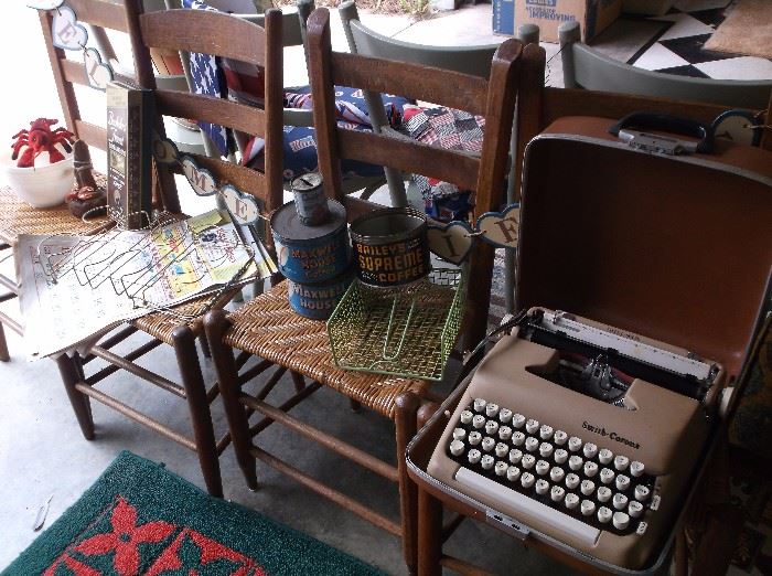 Ladder back chairs w/woven cane seats, portable typewriter, old coffee tins