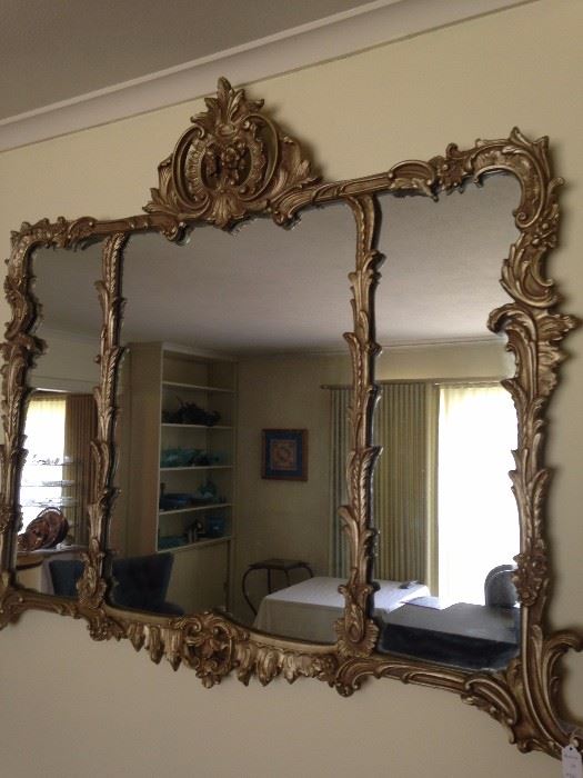 Ornate tri-sectioned mirror