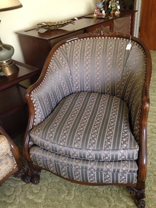 Antique chair with lovely wood carving matches the sofa (different fabric but a companion)