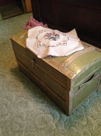 Humpback antique trunk; unfinished needlework