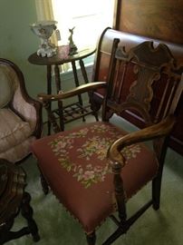 Antique needlepoint chair with beautifully carved wood; small antique side table