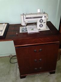 Kenmore sewing machine in cabinet