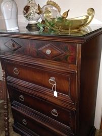 Antique chest has matching nightstand, nightstand, dresser, and twin beds.