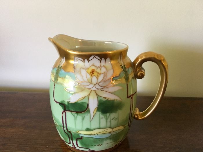 Pickard china.  Milk pitcher. Pond Lily design. Signed Leach.  Limoges blank. Phone sale item.  Bidding begins at 12 pm 5/26.  Pam Newby, IL license number 441.002298.  Opening bid $100